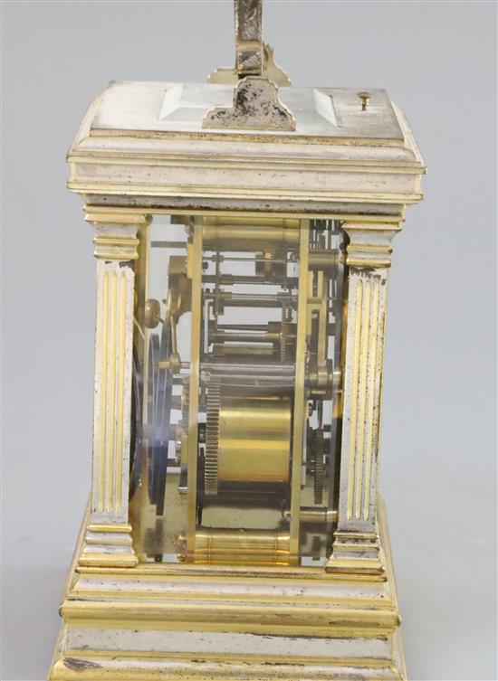 An early 20th century French silvered and parcel gilt hour repeating carriage alarum clock, 7in.